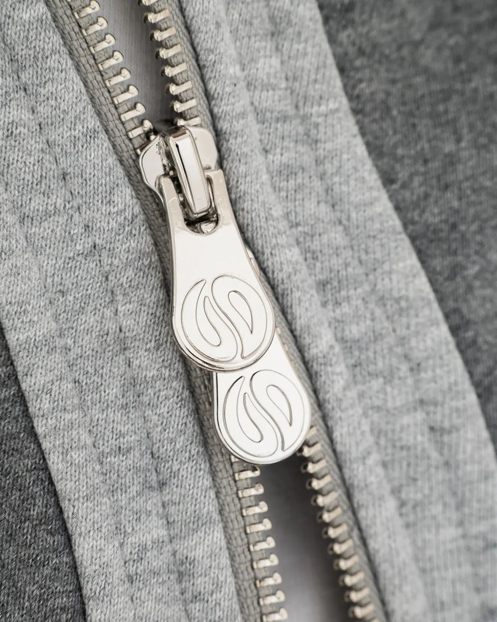 Gray Curved Zipper Hoodie Closeup